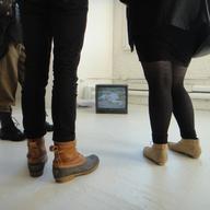 Upstairs at PS1, viewers take in the hype-saturated Laurel Nakadate exhibit.